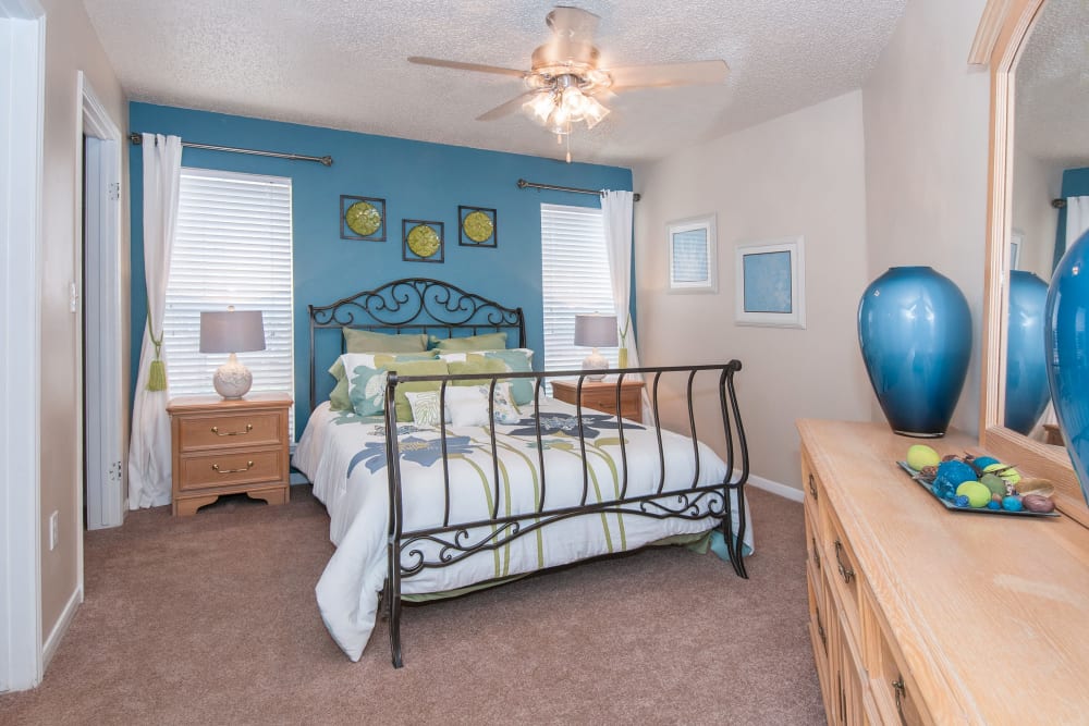 Master bedroom with a blue wall at Ashley Oaks in San Antonio, Texas