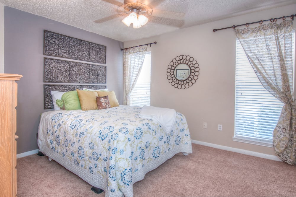 Model bedroom with grey walls at Ashley Oaks in San Antonio, Texas