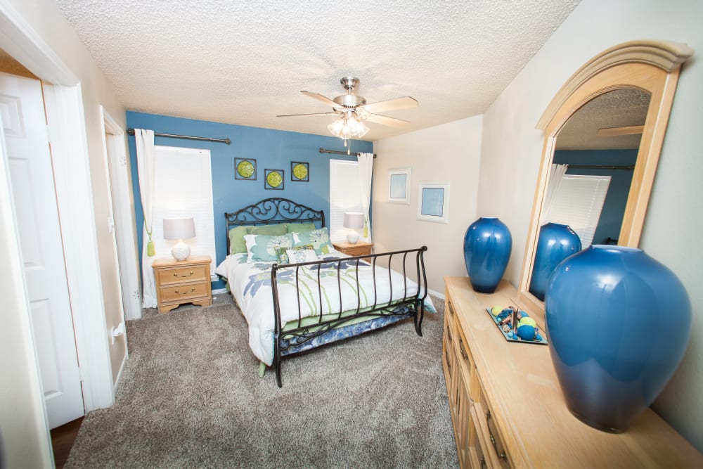 Model bedroom with soft carpet at Ashley Oaks in San Antonio, Texas
