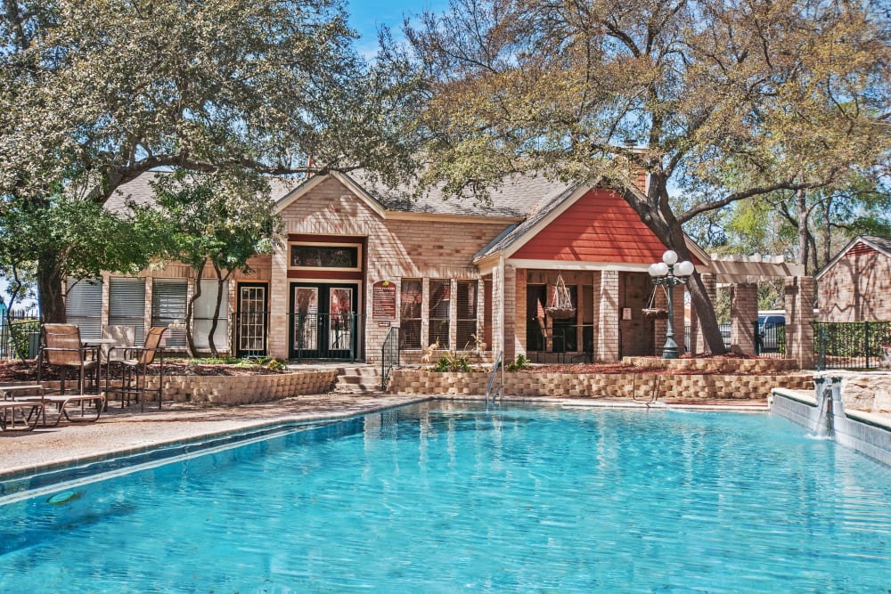 Large pool with trees at Ashley Oaks in San Antonio, Texas