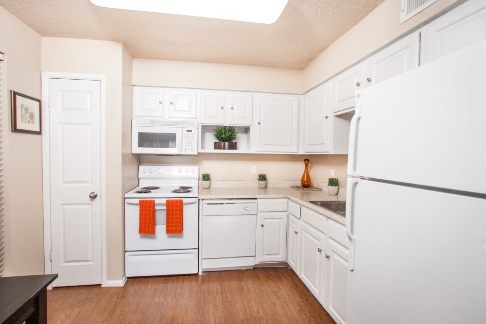 Model kitchen with white cupboards at Ashley Oaks in San Antonio, Texas