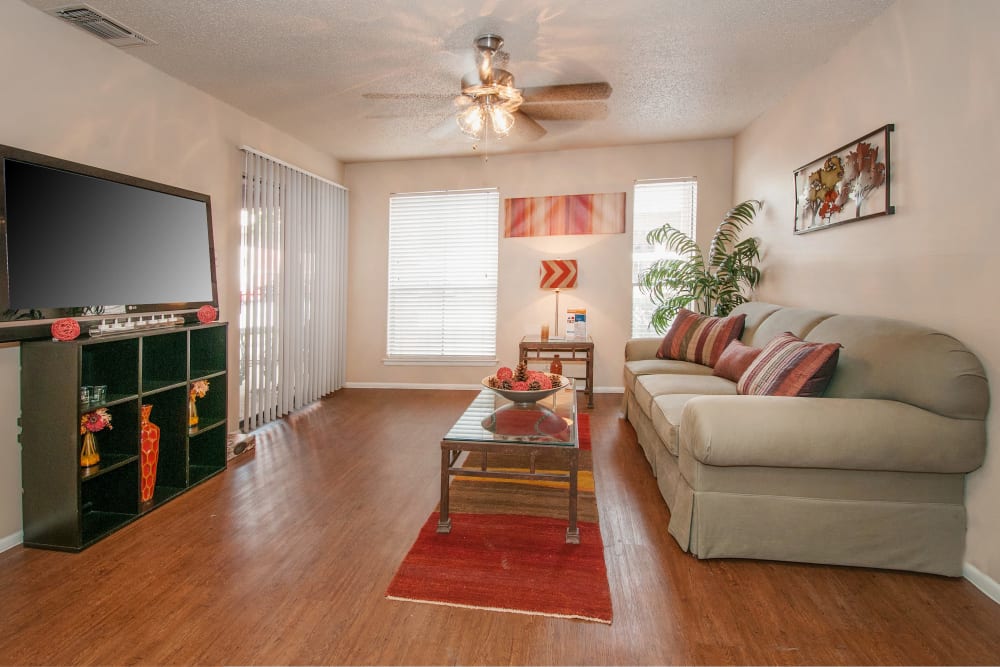 Model living room with wood floors at Ashley Oaks in San Antonio, Texas