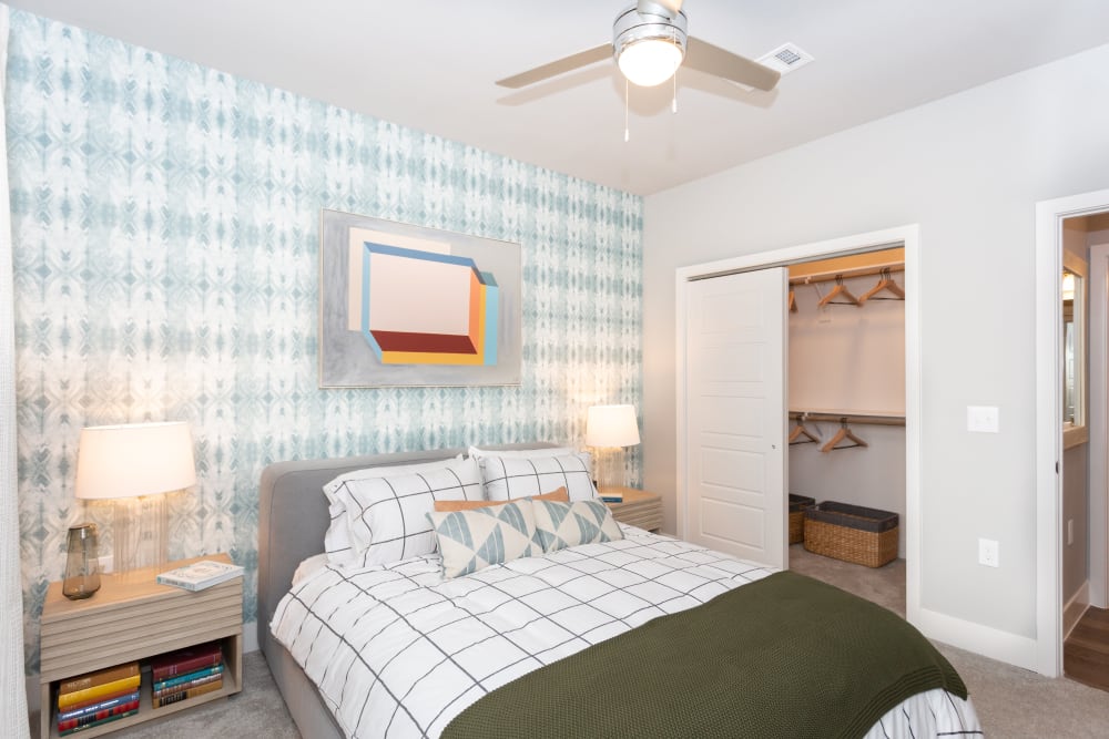 Colorful bedroom with ceiling fan at Coronado on Briarwood in Midland, Texas