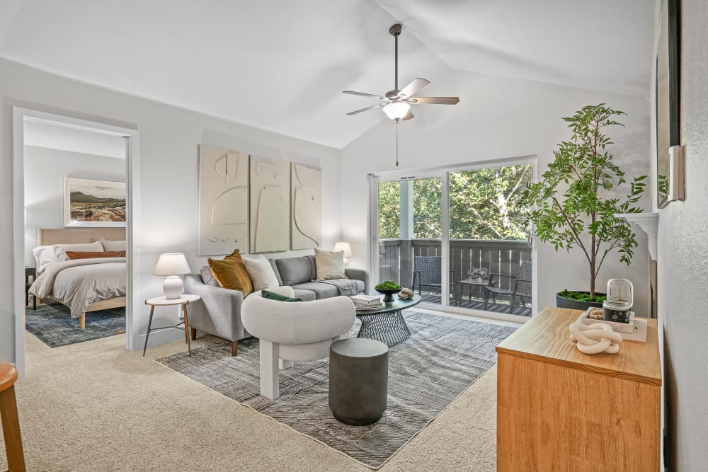 Large living room with a private balcony at Haven at Golf Creek in Portland, Oregon