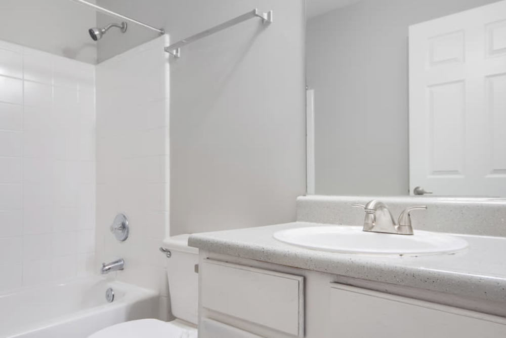 Large bathroom with white walls at Creekside in Doraville, Georgia