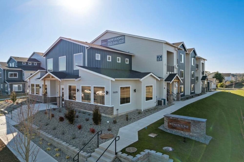 Exterior building with beautiful landscaping at Wyndstone Apartments in Yelm, Washington