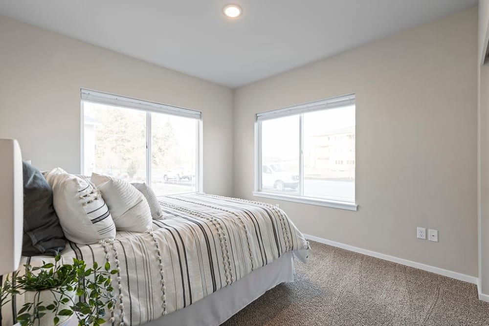 Natural light coming into a master bedroom at Wyndstone Apartments in Yelm, Washington