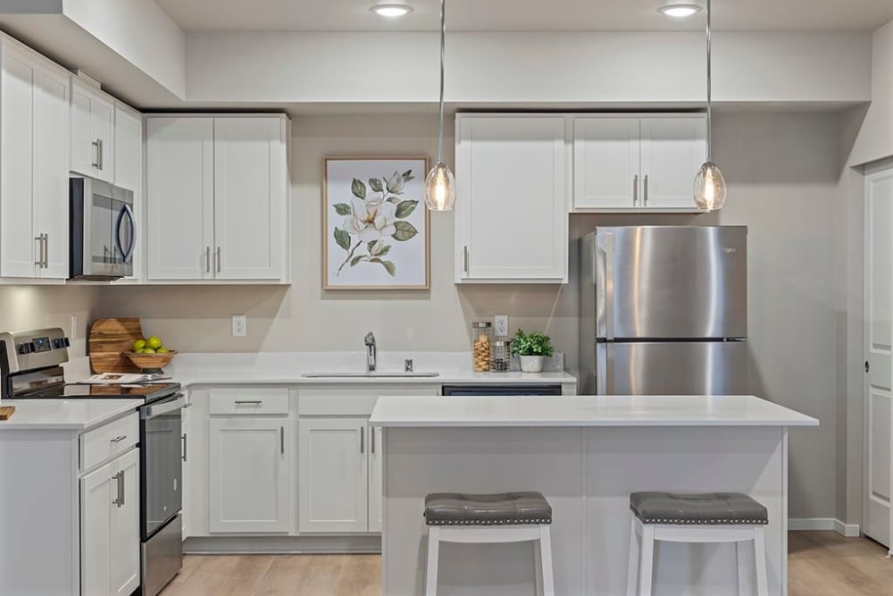 Stainless-steel appliances in a modern kitchen at Wyndstone Apartments in Yelm, Washington