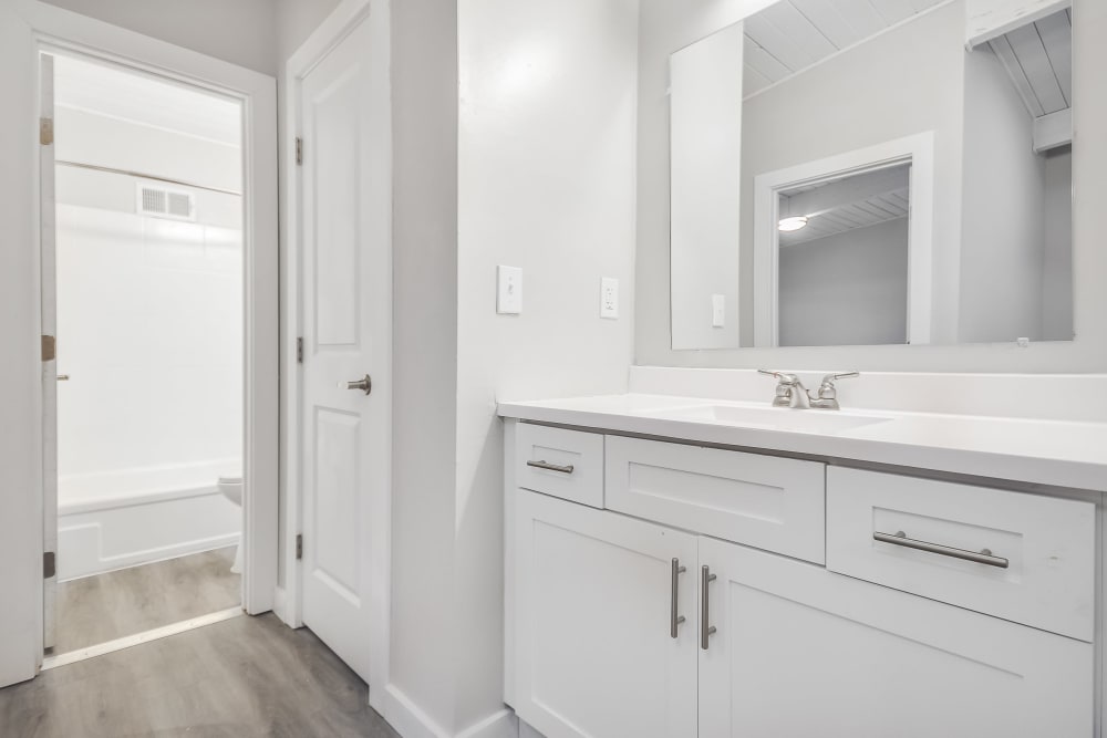 Bathroom with white cabinets at Parkside in Doraville, Georgia