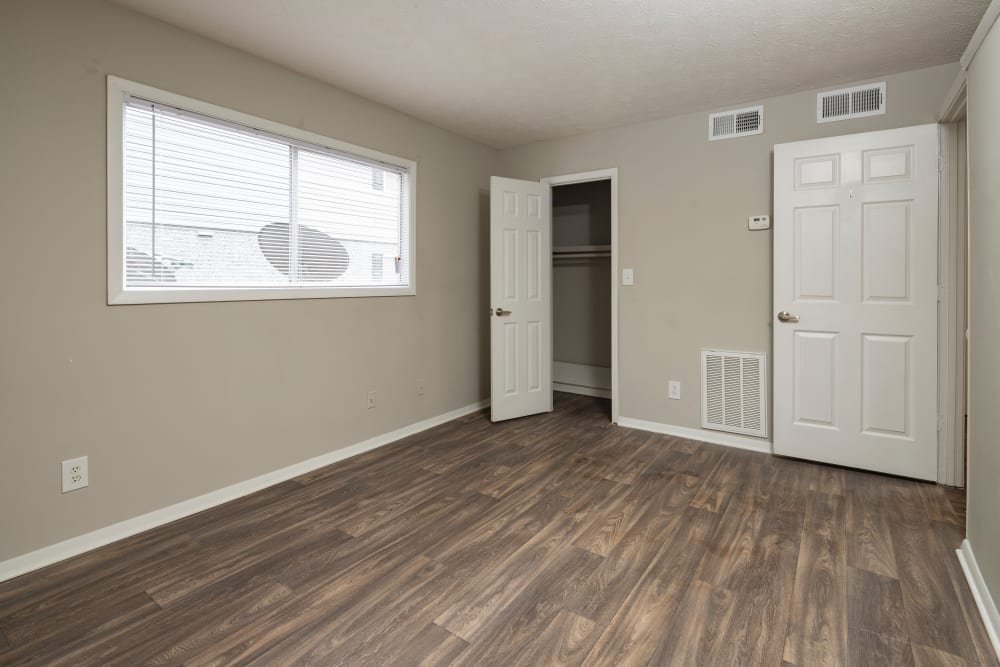 Bedroom with wood-style flooring at Parkside in Doraville, Georgia