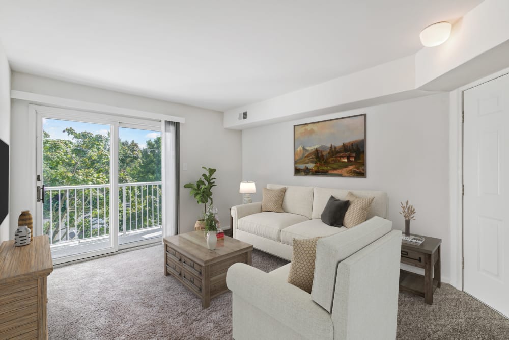 Seagrass Cove Apartment Homes offers a spacious living room with balcony or patio access in Pleasantville, New Jersey