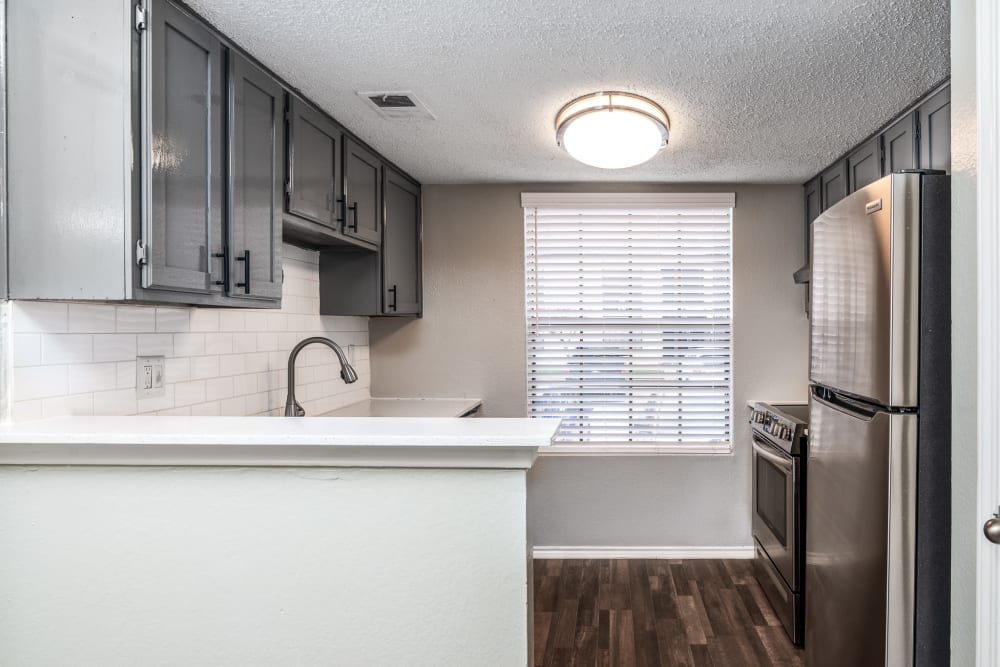 Kitchen with nice lighting at Wythe Apartment Homes in Irving, Texas
