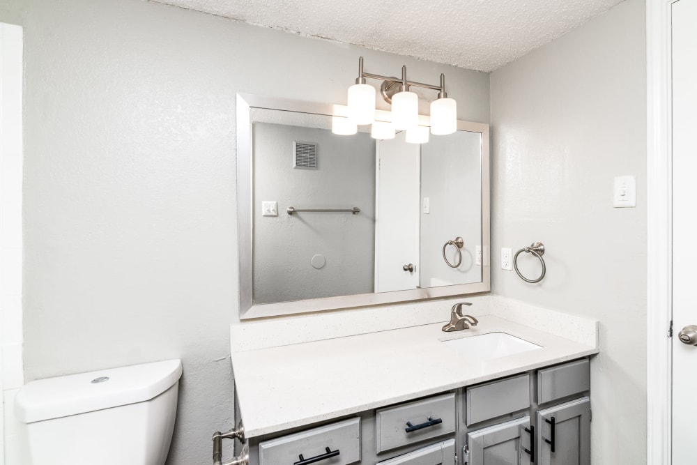Bathroom with nice counters at Wythe Apartment Homes in Irving, Texas