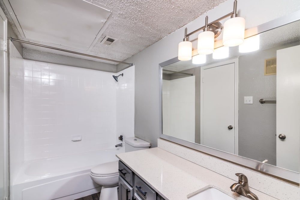 Bathroom with nice lighting at Wythe Apartment Homes in Irving, Texas