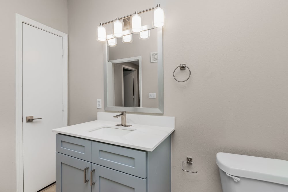 Bathroom with modern details at Cleo Luxury Apartments in Dallas, Texas