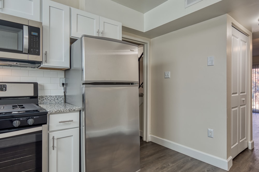 Stainless-steel appliances in an apartment kitchen at Millspring Commons in Richmond, Virginia