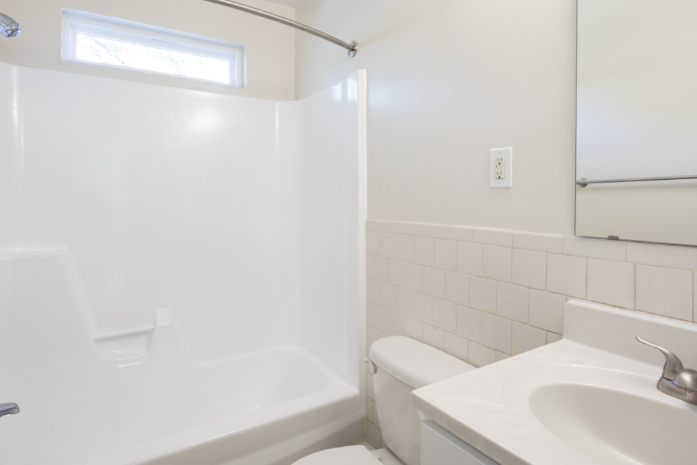 A full-sized bathtub in an apartment bathroom at Millspring Commons in Richmond, Virginia