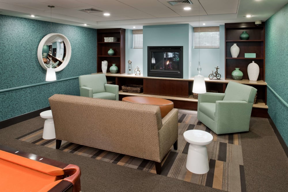 Community gathering space with a fireplace at Camelot Court in Brighton, Massachusetts