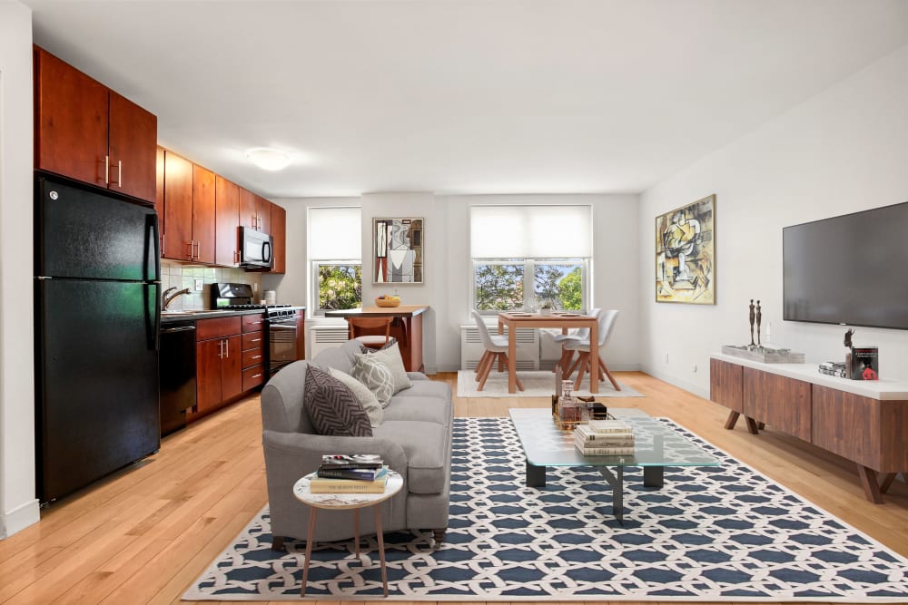 One bedroom living space with wood-style flooring at Camelot Court in Brighton, Massachusetts
