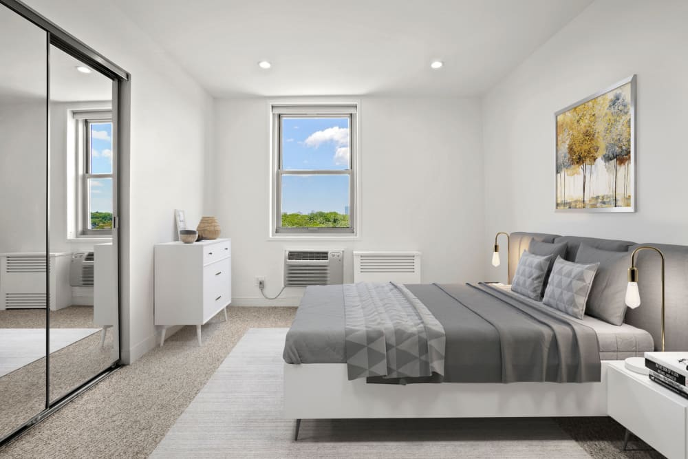 Two bedroom bedroom with mirrored closets at Camelot Court in Brighton, Massachusetts