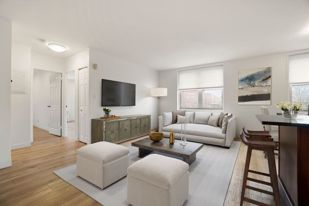 Two bedroom living space with lots of windows at Camelot Court in Brighton, Massachusetts