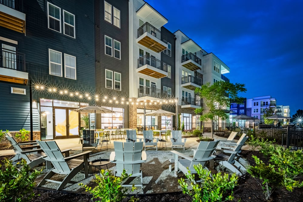 Exterior at night with seating at Series at Riverview Landing in Mableton, Georgia