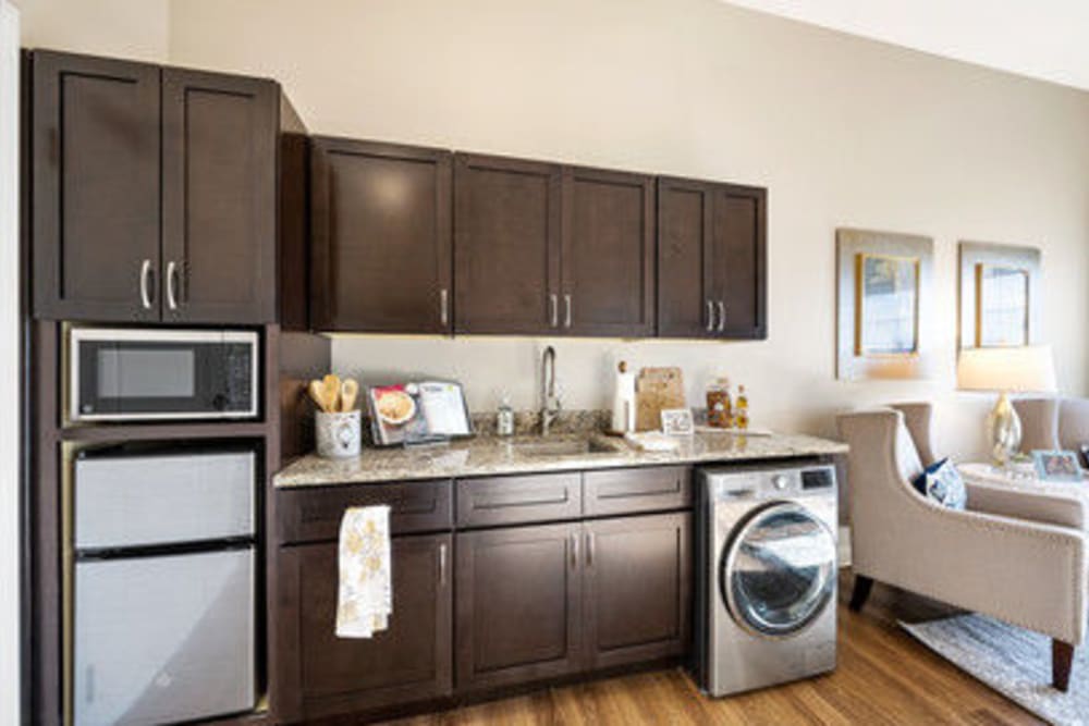 Apartment kitchen with stainless-steel appliances at The Meridian at Carolina Lakes in Indian Land, South Carolina