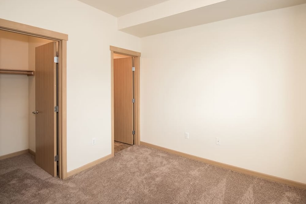 Master bedroom with walk-in closet at Bella on Canyon in Puyallup, Washington