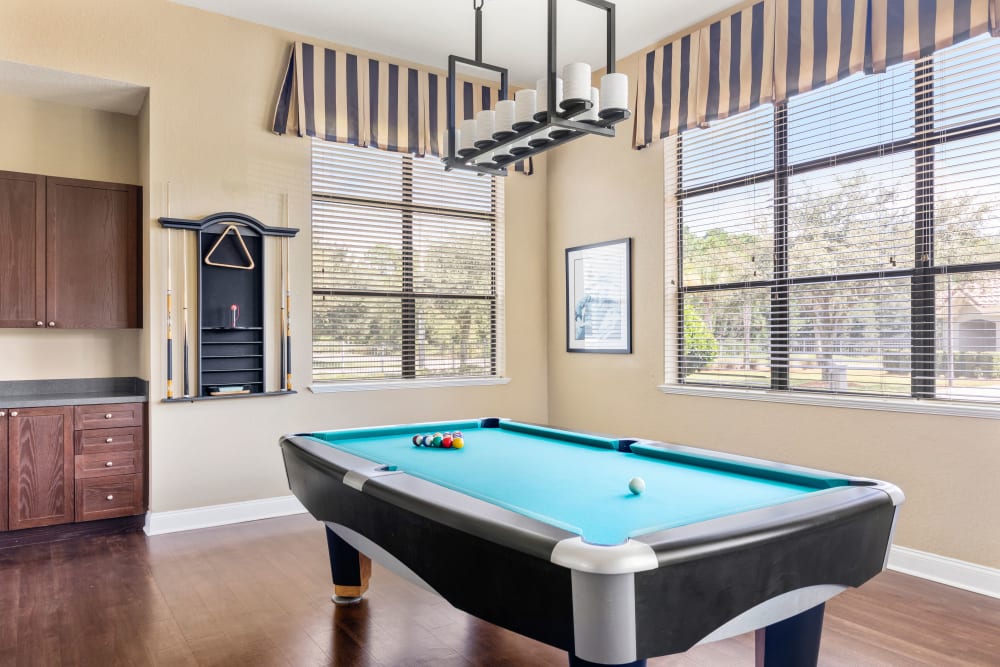 Game room with billiards in the clubhouse at Mirador & Stovall at River City in Jacksonville, Florida 