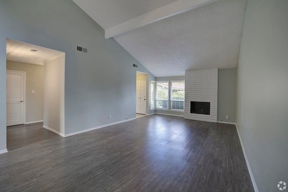 Model living space with large windows at Espana East in Sacramento, California