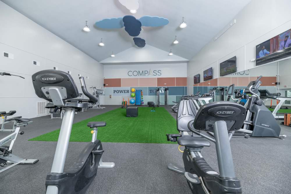 Upscale community center with leather furniture and polished concrete floors. 