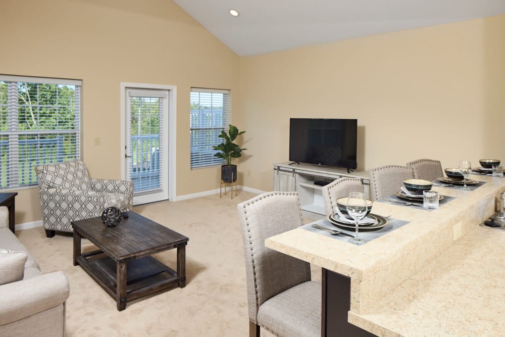 A furnished apartment living room and dining room at Legacy Living Green Township in Cincinnati, Ohio