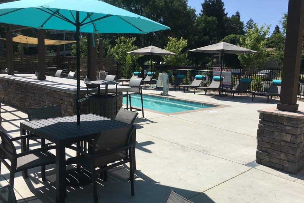 Shaded tables by the spa at Cedar Flats in Chico, California