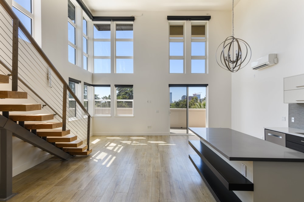Open floor plan with staircase at 16 Powerhouse Apartments in Sacramento, California