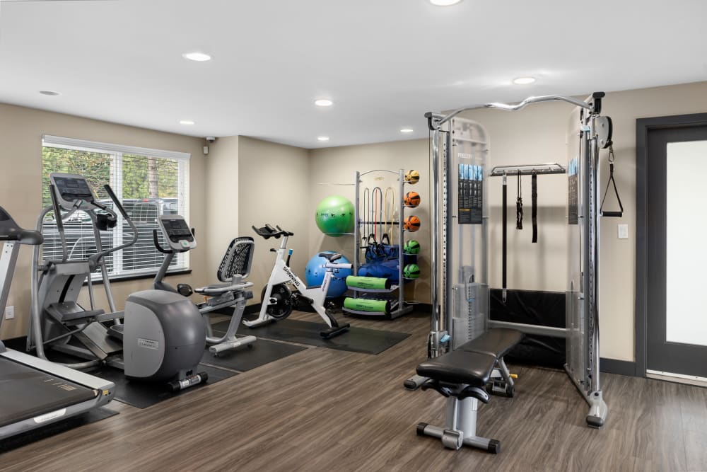 Fitness center with plenty of individual workout stations at Karbon Apartments in Newcastle, Washington