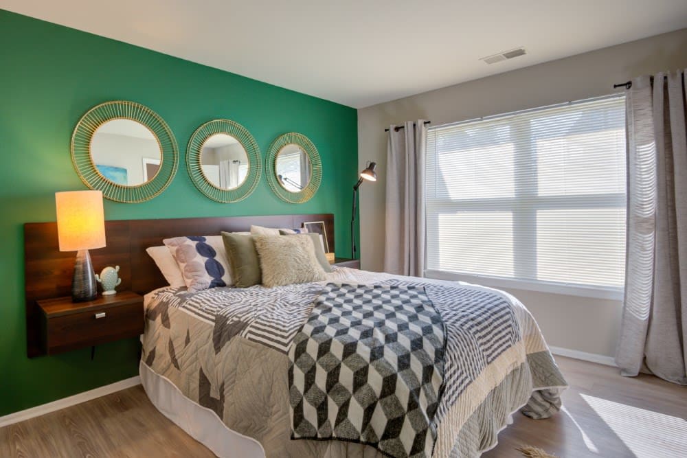 Bedroom with mirrors at Steeplechase Apartments in Largo, Maryland