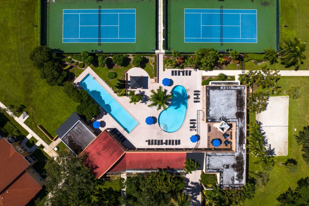 Aerial view of the swimming pools and tennis courts at Azalea Village in West Palm Beach, Florida