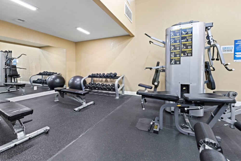 Weightlifting equipment in the fitness center at Azalea Village in West Palm Beach, Florida