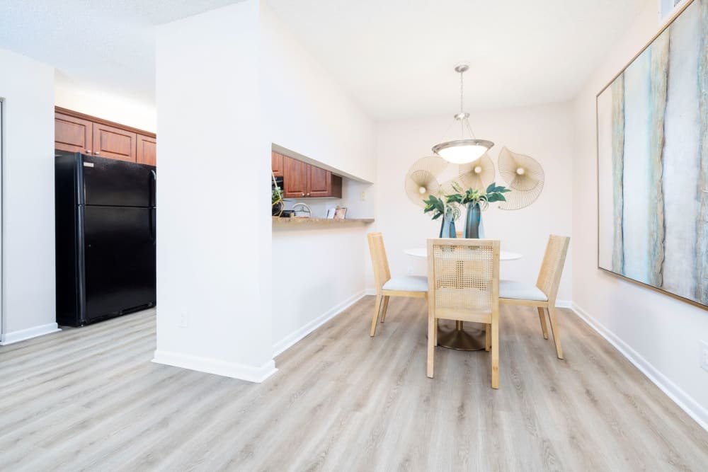 Wood flooring in an apartment kitchen and dining room at Azalea Village in West Palm Beach, Florida