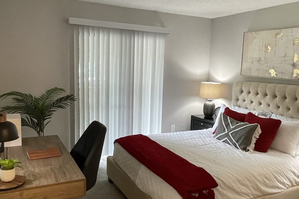 A furnished apartment bedroom at Chapel Creek in Doraville, Georgia