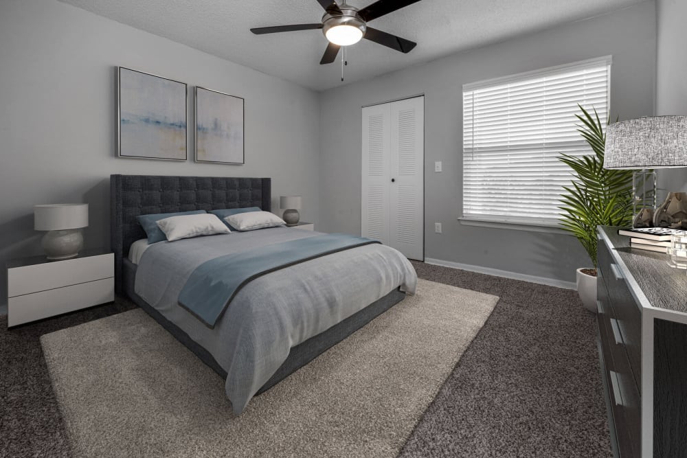 Mater bedroom with a ceiling fan at Sabal Palm in Tampa, Florida