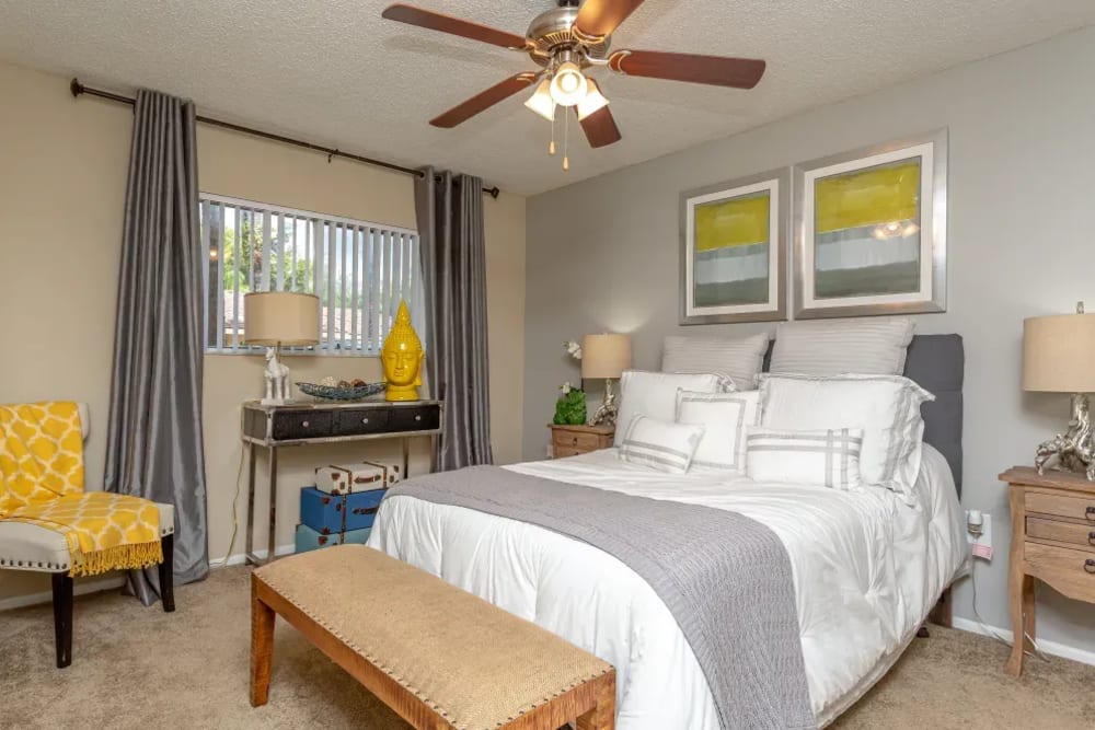 A spacious apartment bedroom with a ceiling fan at Fairway View in Hialeah, Florida