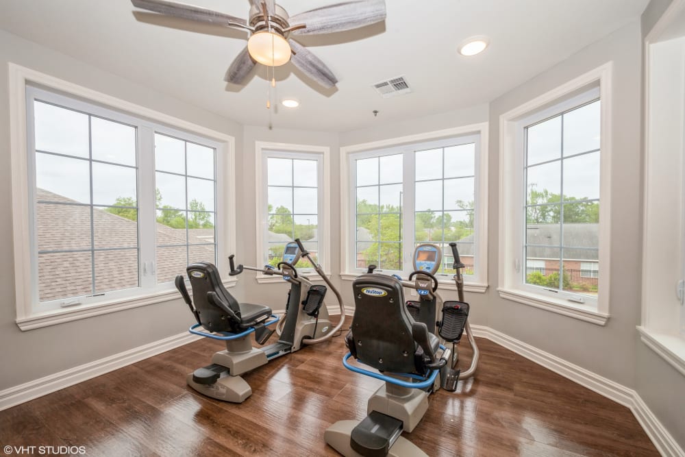 Exercise bikes in front of windows at Barclay House of Baton Rouge in Baton Rouge, Louisiana