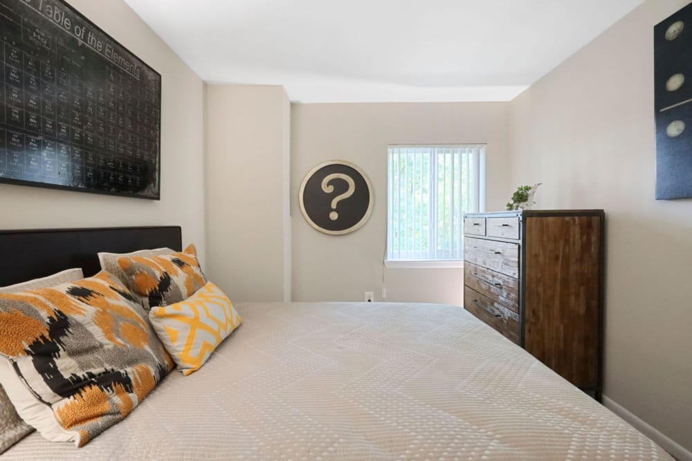 Modern bedroom at The Seasons Apartments in Laurel, Maryland