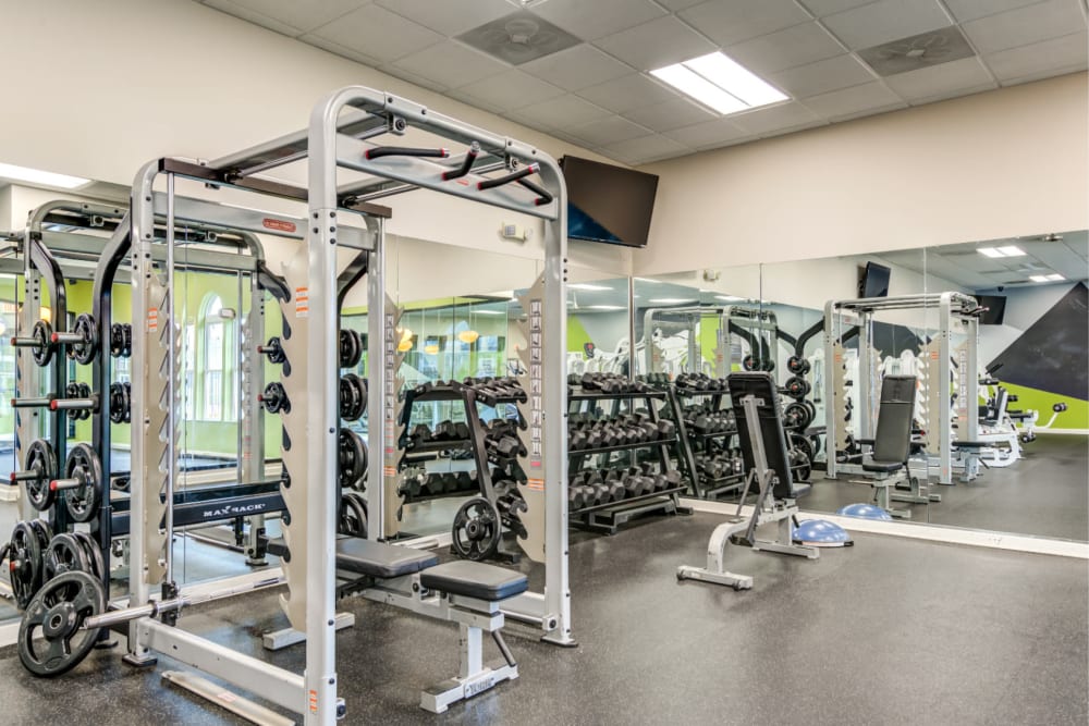 Fitness center with a rack at The Seasons Apartments in Laurel, Maryland