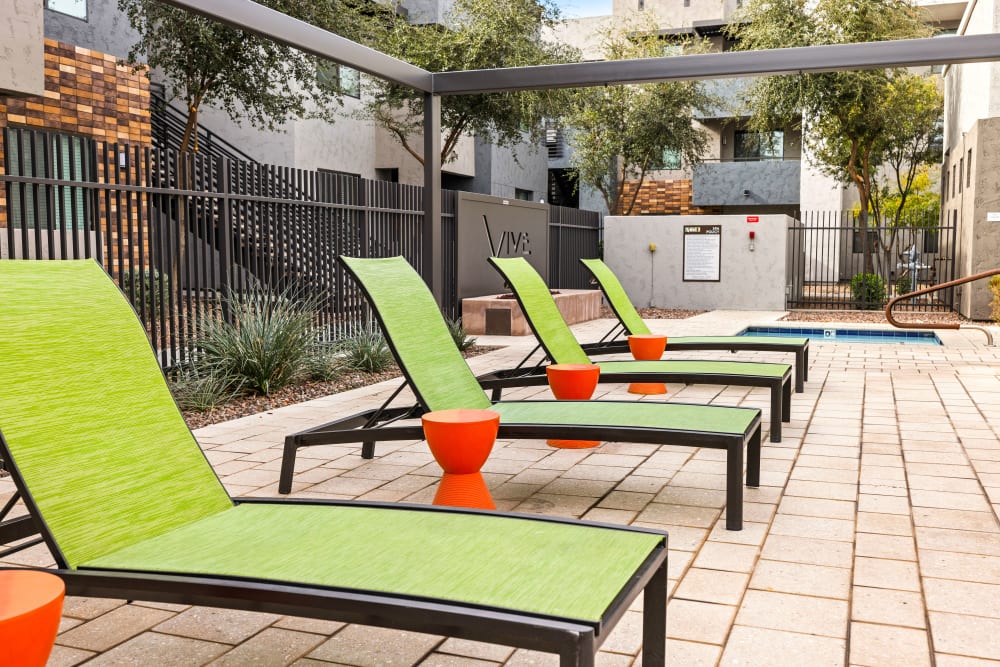 Resort-style swimming pool sun bath chair at Vive in Chandler, Arizona