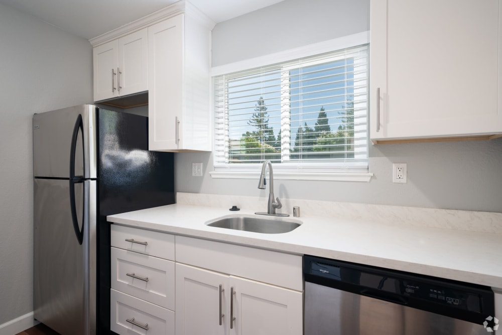 Stainless-steel appliances in a modern kitchen at Creekside Park Apartments in Napa, California