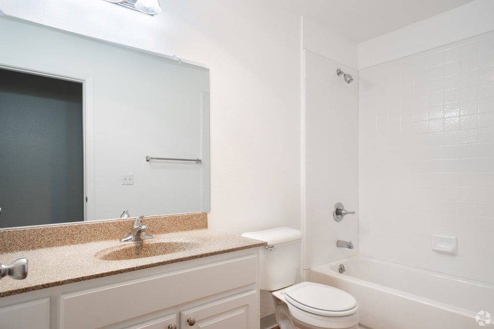 Bathroom with mirror at Creekside Park Apartments in Napa, California