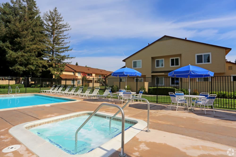 Resort style saltwater pool sundeck cabana at Creekside Park Apartments in Napa, California
