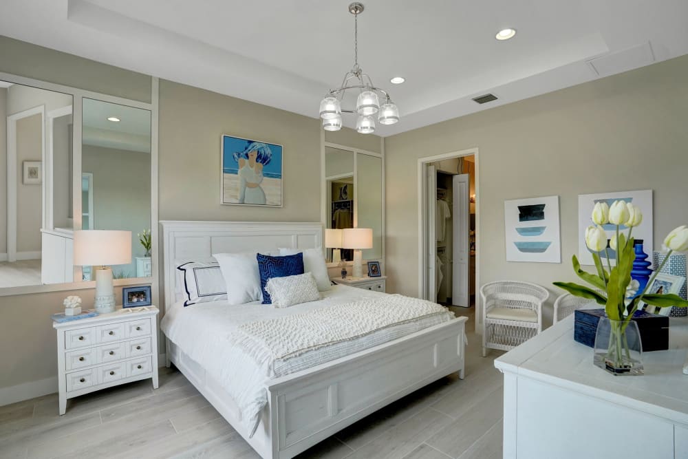 Large main bedroom with matching end tables and closet at Solera at Avalon Trails in Delray Beach, Florida